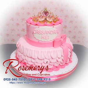 Elegant 2 layer pink princess themed cake, adorned with a ribbon, crafted by Rosemary's Cakes. Contact: 0917-598-9215.