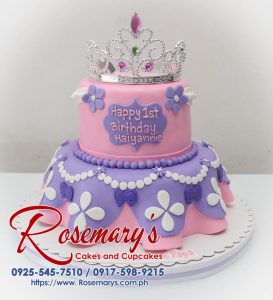Two-tiered pink and purple princess-themed cake with delicate frosting details. Order your custom cake from Rosemary's Cakes: 0917-598-9215.