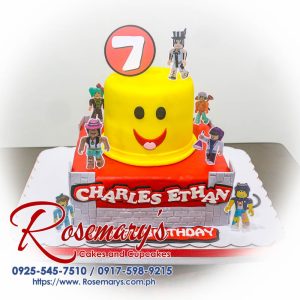 Two-layer red and yellow Roblox themed cake with white frosting accents. Delicious cake by Rosemary's Cakes. Order yours today! Call 0917-598-9215.