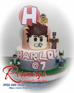 Delicious 2 layer Roblox themed cake by Rosemary's Cakes, featuring vibrant red and white colors. Contact: 0925-545-7510.
