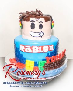 Delicious 2-layer Roblox themed cake with vibrant colors and decorative characters. From Rosemary's Cakes. Call 0925-545-7510.