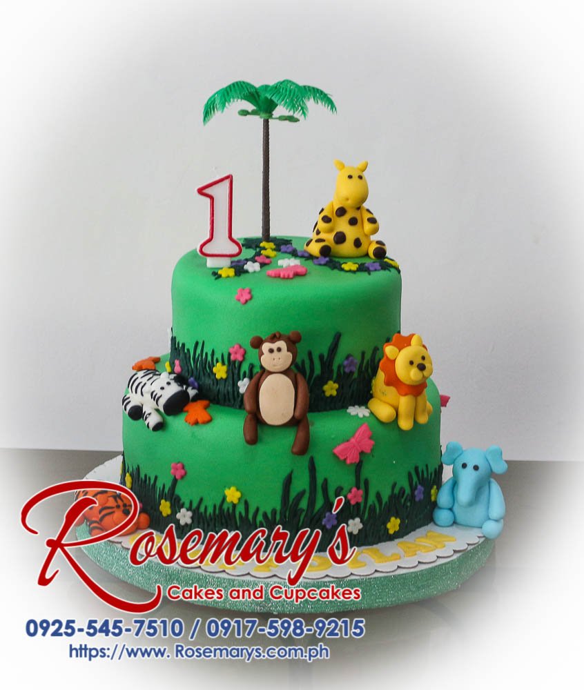 Delicious two-tier safari cake featuring handcrafted fondant animals like a lion, giraffe, elephant, tiger, and monkey. Rosemary's Cakes | 0917-598-9215