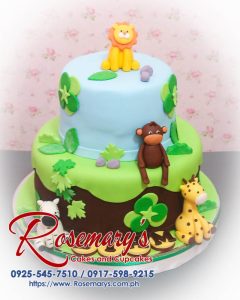 Delicious 2 layer safari themed cake with vibrant animal decorations, crafted by Rosemary's Cakes. Contact: 0917-598-9215.