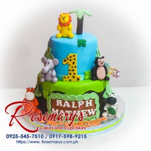 Delicious 2-layer safari themed cake featuring vibrant animals, blue and green decor from Rosemary's Cakes, contact 0917-598-9215.