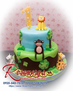 A delicious 2 layer safari themed cake featuring vibrant blue and green colors with adorable animal decorations. Rosemary's Cakes, 0917-598-9215.