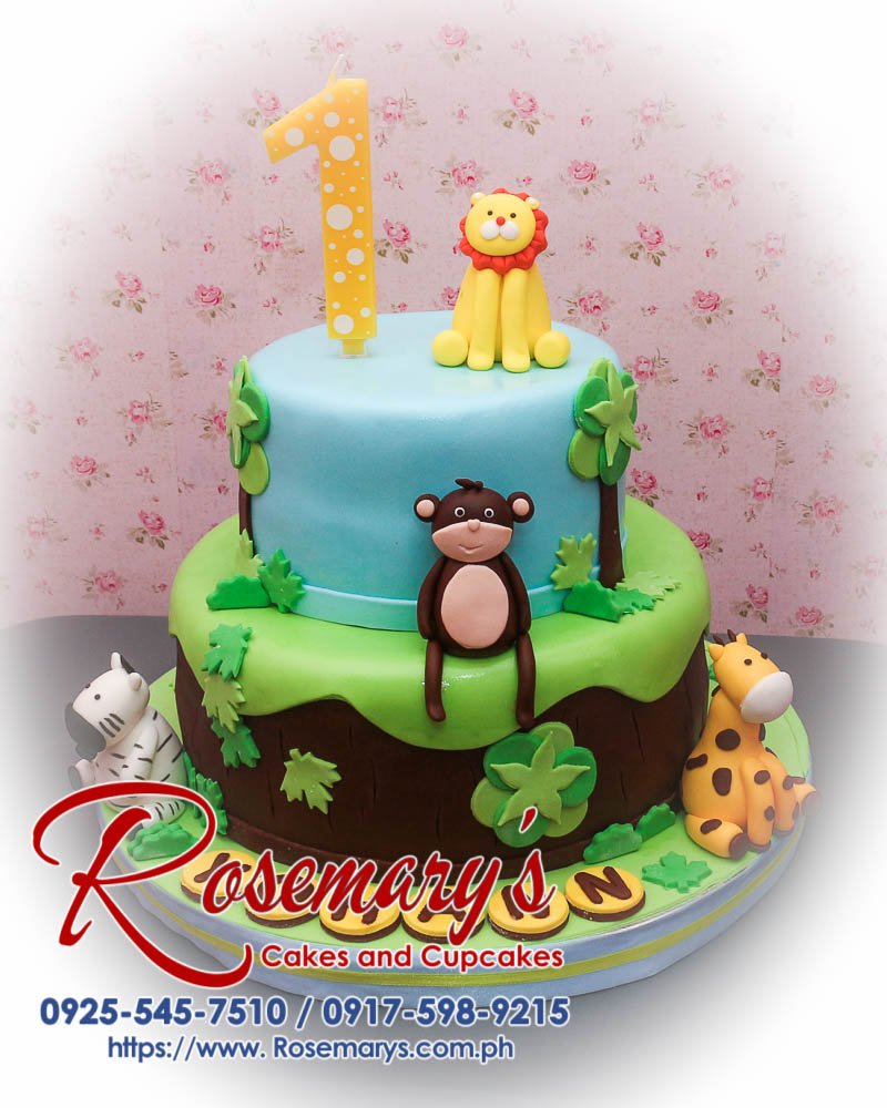 A delicious 2 layer safari themed cake featuring vibrant blue and green colors with adorable animal decorations. Rosemary's Cakes, 0917-598-9215.