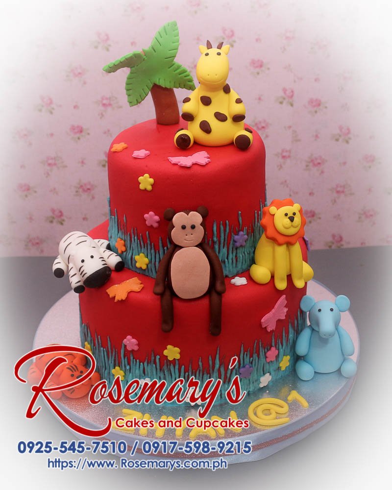2 Layer Safari Themed Cake for Zhyan’s 1st Birthday Delicious 2 layer safari themed cake featuring fondant animals like elephants, giraffes, and lions. From Rosemary's Cakes, 0917-598-9215.