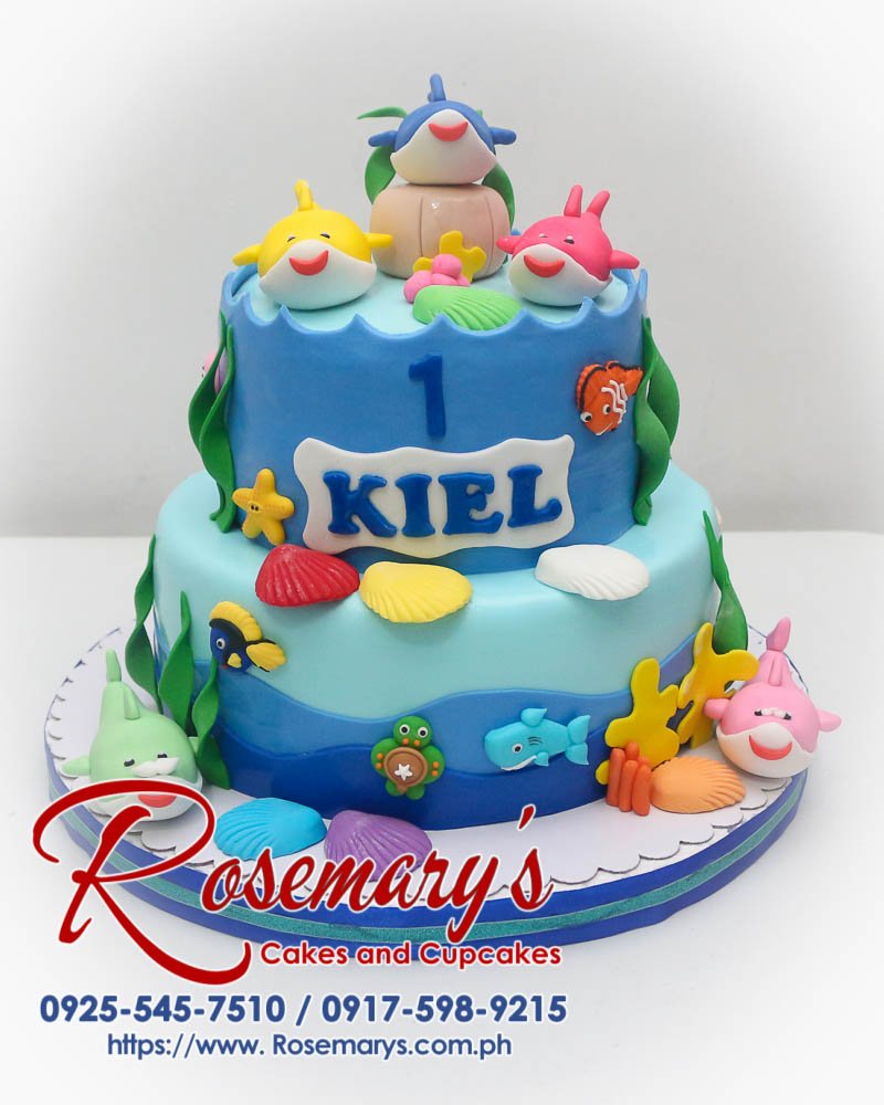 2 Layer Shark Family Cake for Kiel Two-tier shark family themed cake featuring intricate fondant sharks and ocean details. Rosemary's Cakes | 0917-598-9215