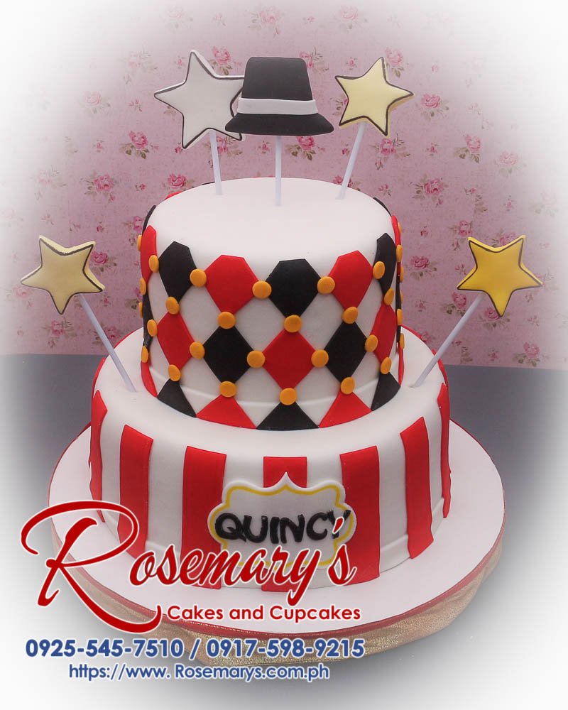 Delicious 2 layer black and red showman themed cake adorned with stars, crafted by Rosemary's Cakes. Contact: 0917-598-9215.