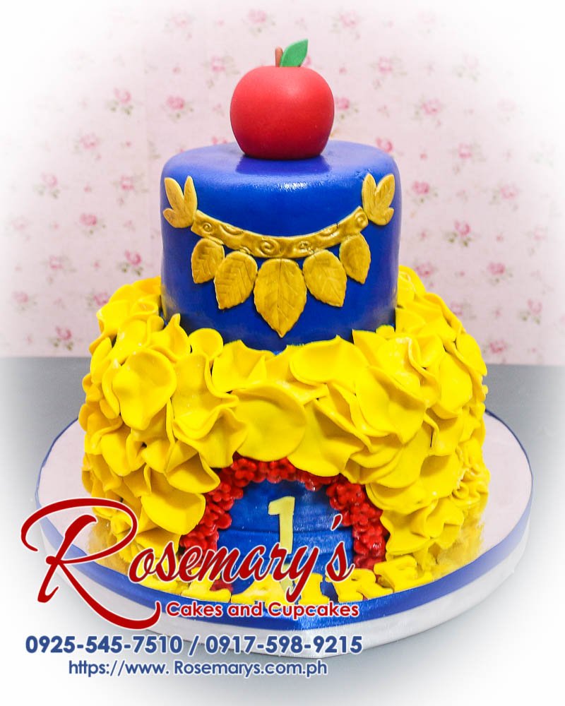 Delicious 2-layer Snow White themed cake in blue and yellow, crafted by Rosemary's Cakes. Contact: 0925-545-7510.