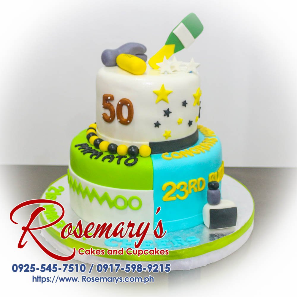 Delicious two-layer split cake with vibrant blue and green icing. Perfect for birthdays! Order yours from Rosemary's Cakes: 0925-545-7510.