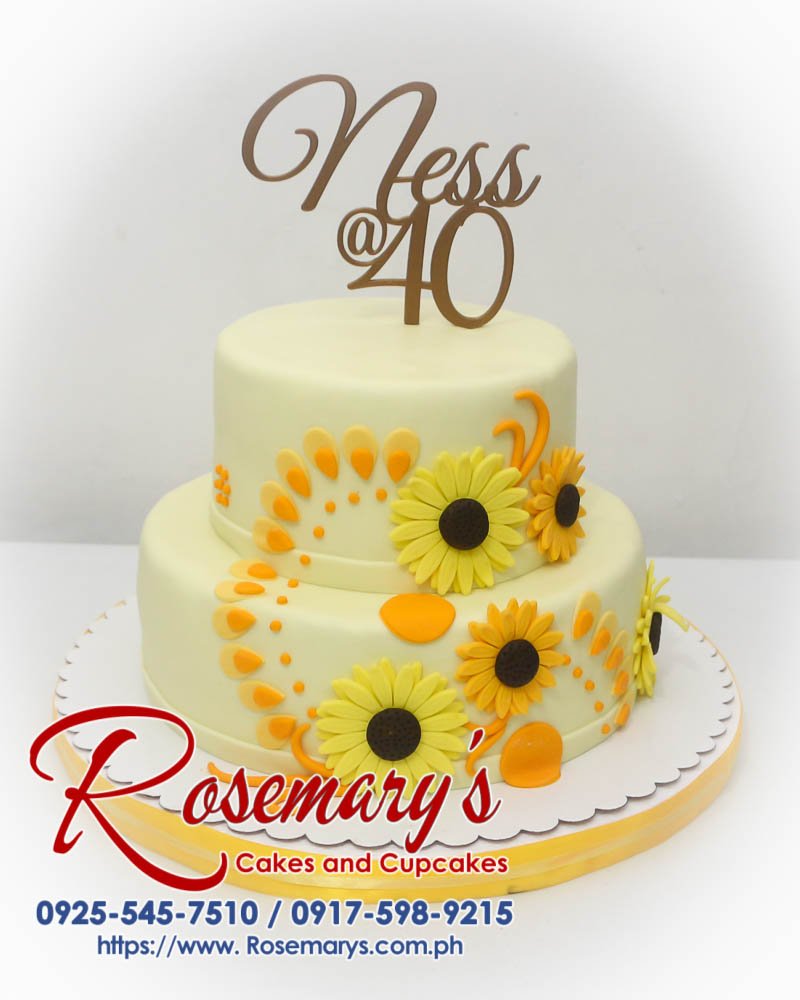 2 Layer Sunflowers Themed Cake for Ness’ 40th Birthday Two-tier yellow cake adorned with sunflowers and a 3D printed topper. Delicious custom cakes by Rosemary's Cakes, call 0917-598-9215.