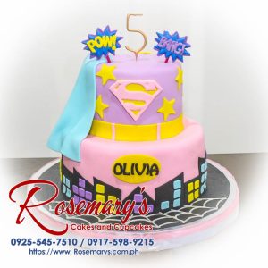 Two-layer pink Supergirl themed cake with intricate frosting details. Delicious and perfect for birthdays! Rosemary's Cakes | 0925-545-7510