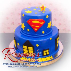 Delicious 2 layer Superman themed cake in blue and red with intricate decorations. Order from Rosemary's Cakes, 0925-545-7510.