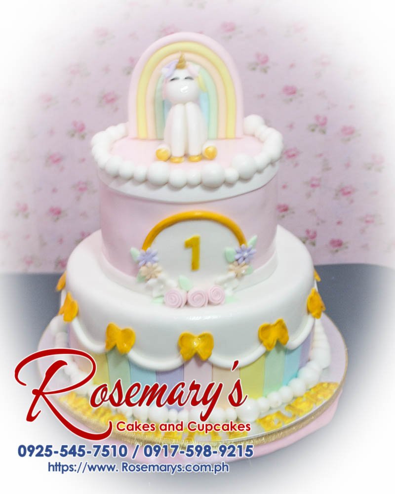 2 Layer Unicorn Cake for Elisha Vibrant 2 layer unicorn cake featuring gold accents, pastel rainbow colors, and whimsical design. Order at Rosemary's Cakes 0917-598-9215.