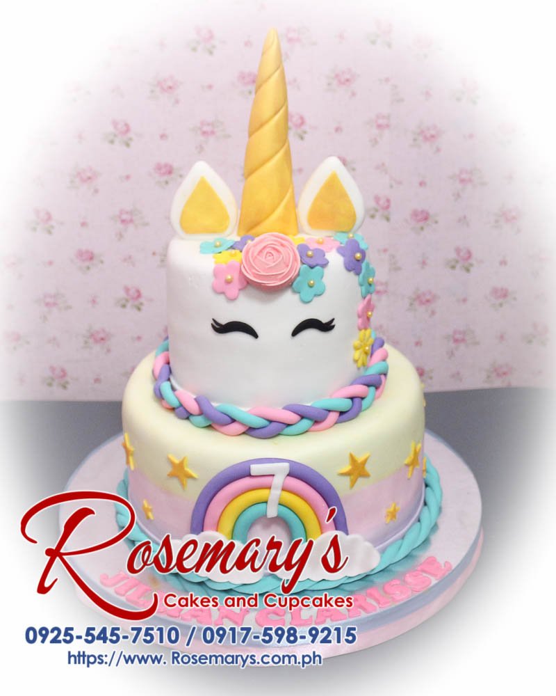 Delicious 2 layer unicorn cake with pastel pink and rainbow frosting, perfect for any celebration. Order at Rosemary's Cakes 0917-598-9215.