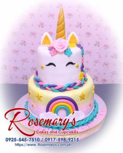 Delicious 2 layer unicorn cake with pastel rainbow colors and gold accents. Perfect for themed celebrations. Rosemary's Cakes, 0917-598-9215.