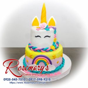 Delicious 2 layer unicorn themed cake in pastel gold and pink with a vibrant rainbow design. Order from Rosemary's Cakes at 0917-598-9215.
