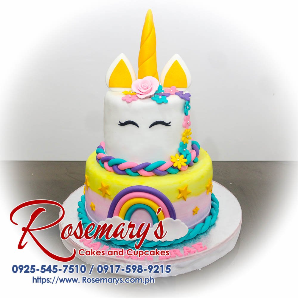 Delicious 2 layer unicorn themed cake in pastel gold and pink with a vibrant rainbow design. Order from Rosemary's Cakes at 0917-598-9215.