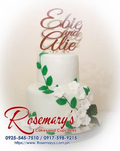 Elegant 2-layer wedding cake from Rosemary's Cakes, featuring intricate 3D printed designs. Order yours at 0917-598-9215.