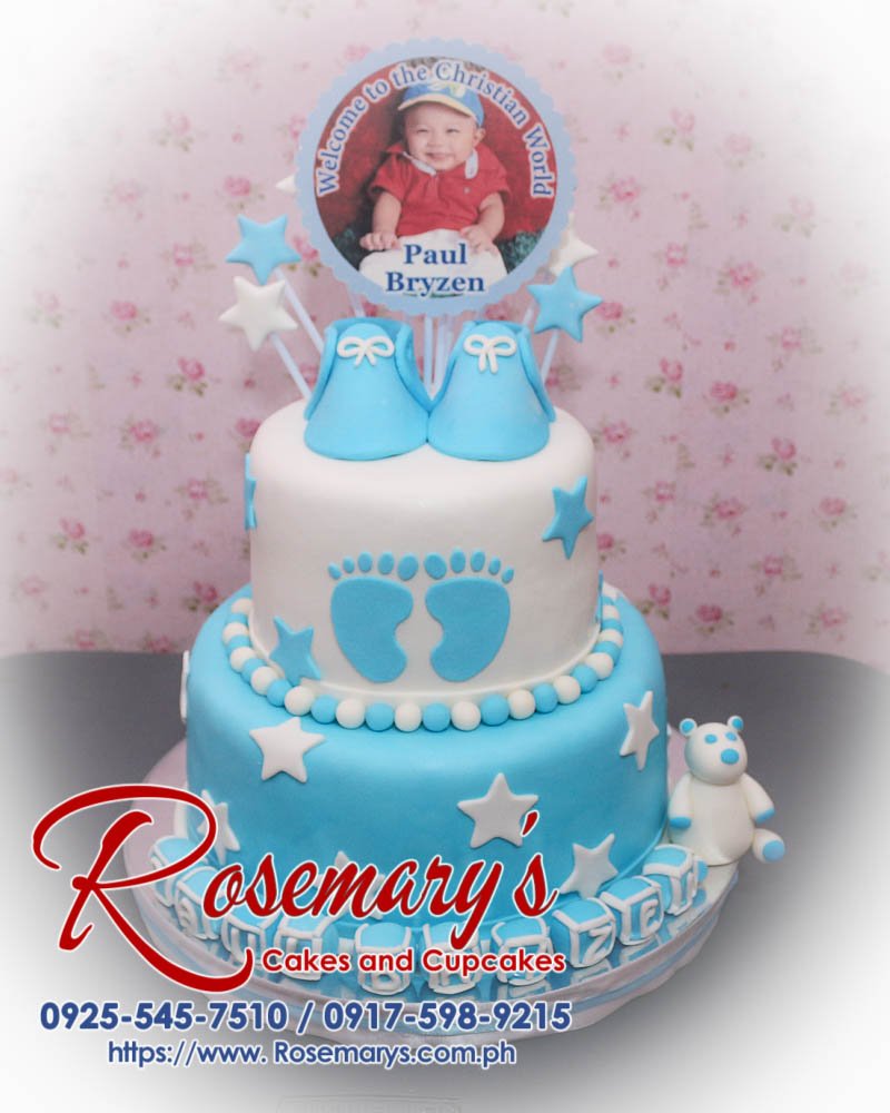 Delicious 2 layer white and blue themed cake featuring baby shoes and blocks, perfect for a baptismal celebration. Rosemary's Cakes, 0925-545-7510.