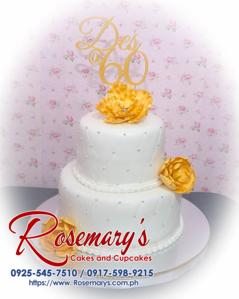 Elegant 2-layer white and gold themed cake from Rosemary's Cakes, featuring intricate 3D printed details. Contact: 0917-598-9215.