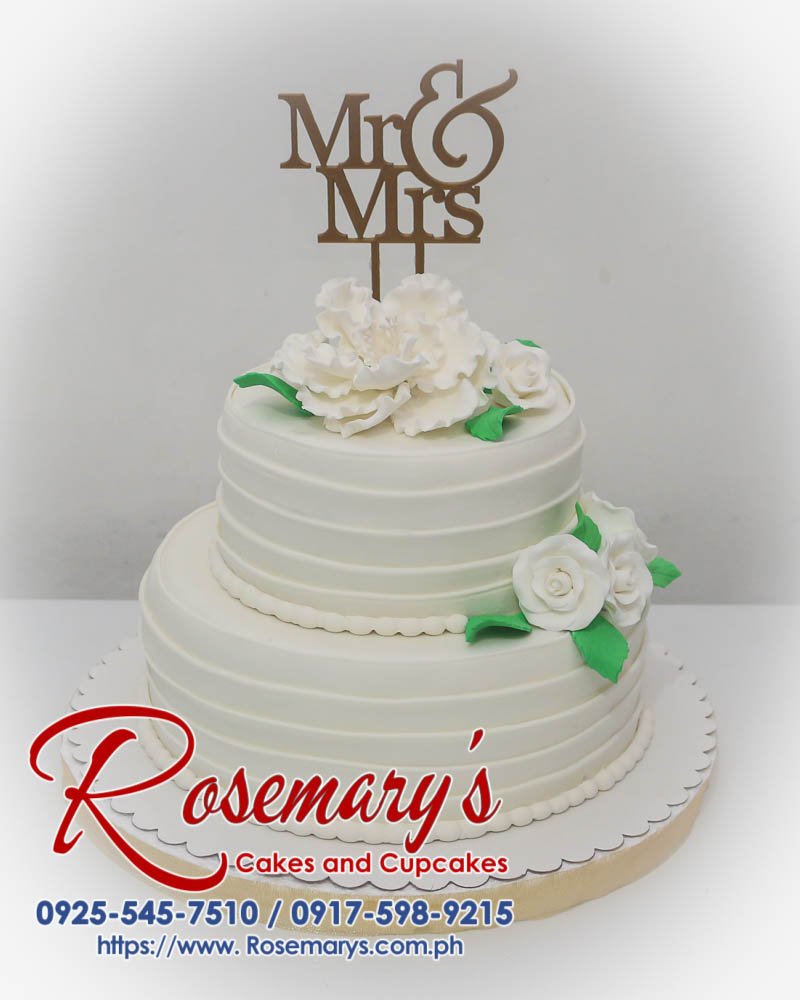 Elegant 2-tier white and gold wedding cake adorned with a 3D printed 