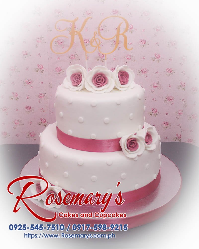 2 Layer White and Peach Wedding Cake with a Custom 3D Printed Topper Elegant 2 layer white and peach wedding cake featuring a custom 3D printed topper. Order delicious cakes at Rosemary's Cakes: 0917-598-9215.