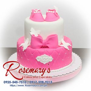 A stunning 2 layer white and pink themed cake, beautifully adorned with a ribbon. Order from Rosemary's Cakes at 0925-545-7510.