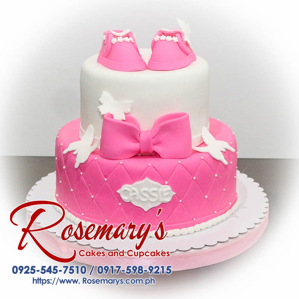 A stunning 2 layer white and pink themed cake, beautifully adorned with a ribbon. Order from Rosemary's Cakes at 0925-545-7510.