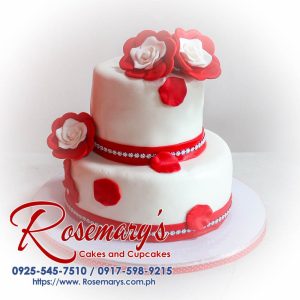 Delicious 2 layer white cake adorned with stunning red roses, perfect for any themed celebration. Rosemary's Cakes, 0925-545-7510.