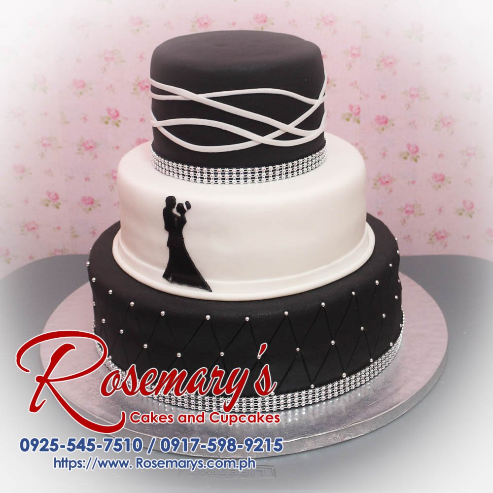 3 Layer Black and White Wedding Cake Sumptuous 3-layer black and white wedding cake featuring elegant design. Perfect for your special day. Rosemary's Cakes, 0917-598-9215.