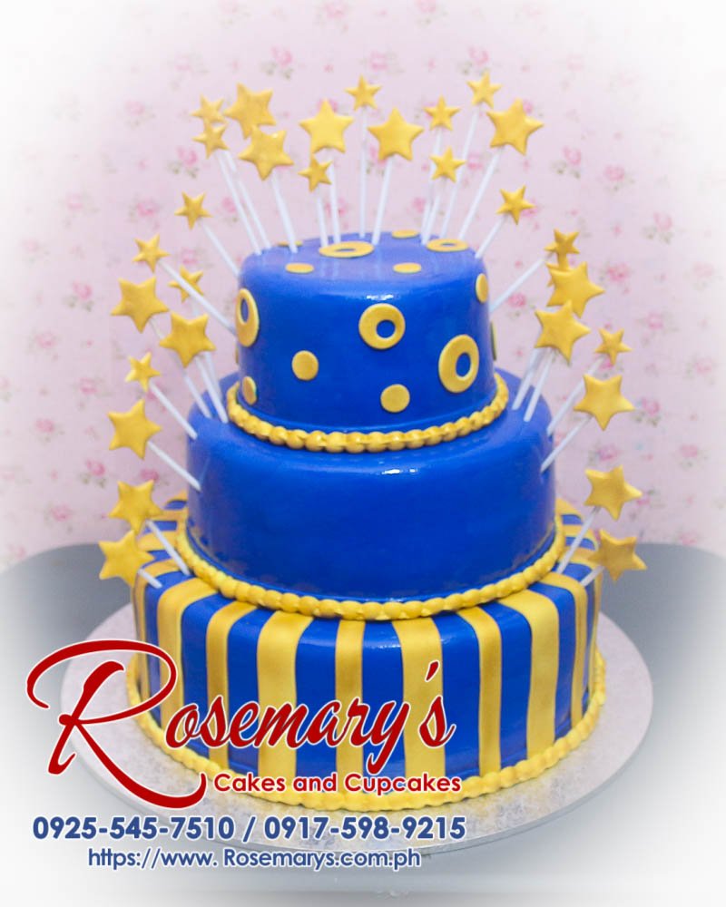 3 Layer Blue and Gold Cake Three-layer blue and gold cake adorned with stars, perfect for any celebration. Order from Rosemary's Cakes at 0925-545-7510.