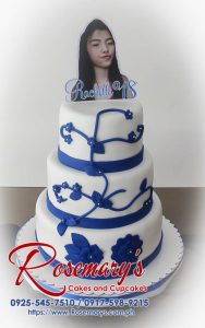 Elegant 3-layer blue and white cake with intricate piping details. Perfect for birthdays and special occasions. Order yours from Rosemary's Cakes! Call 0917-598-9215.