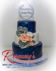 Three-tier blue and silver wedding cake with elegant roses and a custom 3D printed topper. Order your dream cake from Rosemary's Cakes: 0917-598-9215.