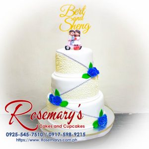 Three-layer wedding cake with intricate 3D printed decorations, perfect for anniversaries. Order from Rosemary's Cakes: 0917-598-9215.