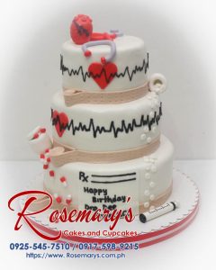 Delicious 3-layer chocolate cake with medical-themed decorations. Order yours from Rosemary's Cakes! Call 0925-545-7510.