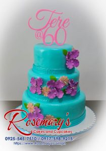 Stunning 3-layer blue and pink cake with a vibrant 3D printed topper. Flowers in pink and violet accents adorn this celebratory dessert. Order yours today! Rosemary's Cakes: 0917-598-9215