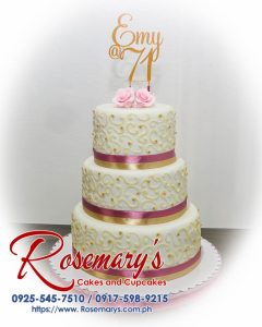 Three-layer gold, white, and pink themed cake by Rosemary's Cakes, featuring intricate 3D printed details. Contact: 0925-545-7510.
