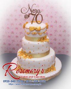 Three-layer gold and white themed cake with a 3D printed topper, perfect for celebrations. Rosemary's Cakes, 0925-545-7510.