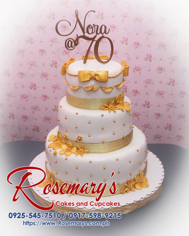 3 Layer Gold and White Cake for Nora’s 70th Birthday Three-layer gold and white themed cake with a 3D printed topper, perfect for celebrations. Rosemary's Cakes, 0925-545-7510.