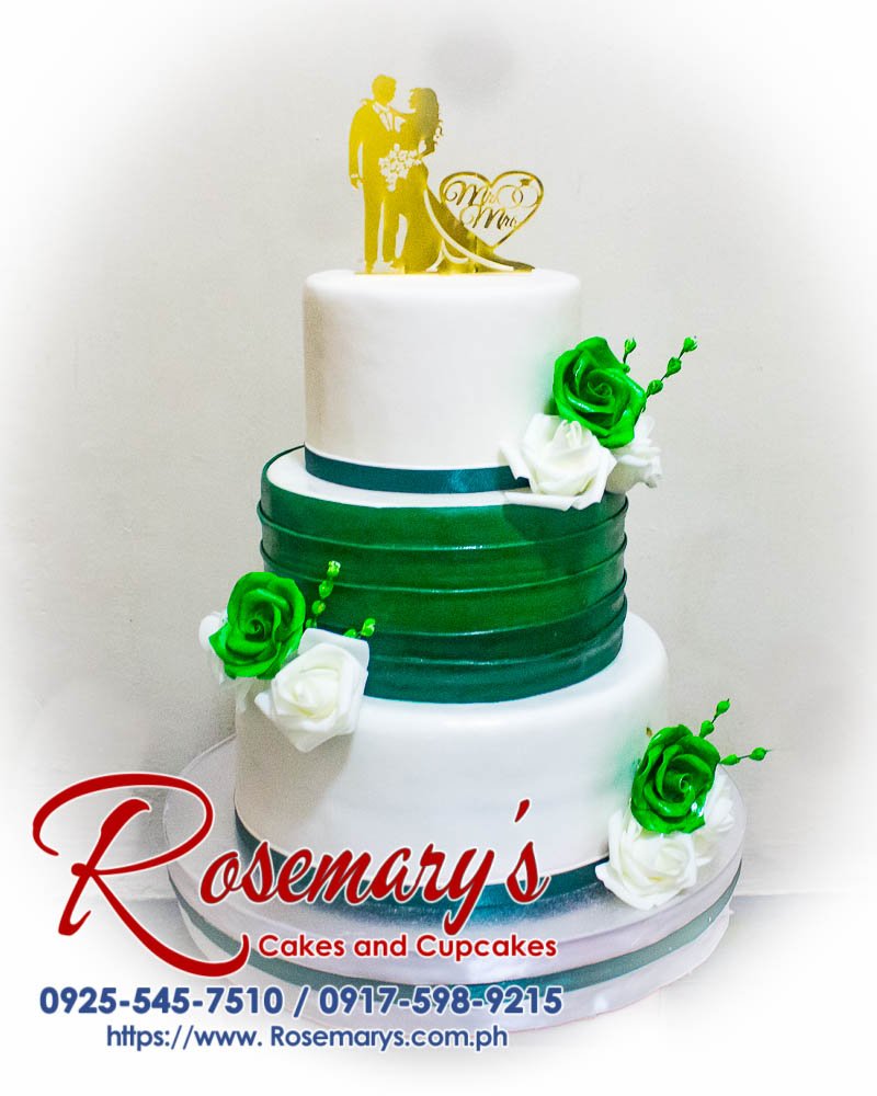 3 Layer Green and White Rose Mr and Mrs Wedding Cake Three-tiered vanilla cake adorned with delicate white and green roses. Perfect for weddings or special occasions! Order from Rosemary's Cakes: 0925-545-7510