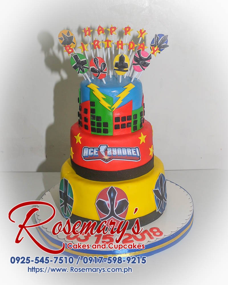 Delicious 3-layer Power Rangers cake with blue, yellow and red accents. Order your custom cake from Rosemary's Cakes: 0925-545-7510.