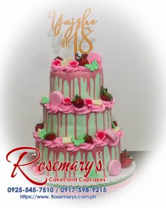 Delicious 3-layer strawberry cake adorned with delicate pink macarons. Perfect for birthdays and celebrations! Order yours from Rosemary's Cakes, 0917-598-9215.