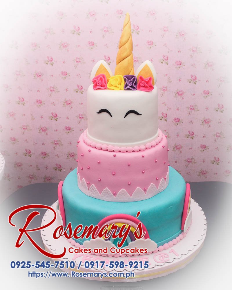Delicious 3 layer unicorn cake with blue and pink frosting, rainbow details and whimsical design. Order from Rosemary's Cakes at 0917-598-9215.