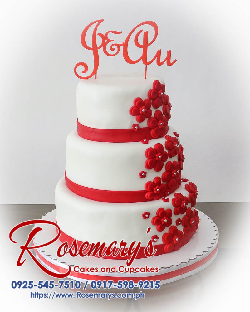 Elegant three-tier red wedding cake adorned with a stunning 3D printed topper. Made by Rosemary's Cakes. Call 0917-598-9215 to order yours!
