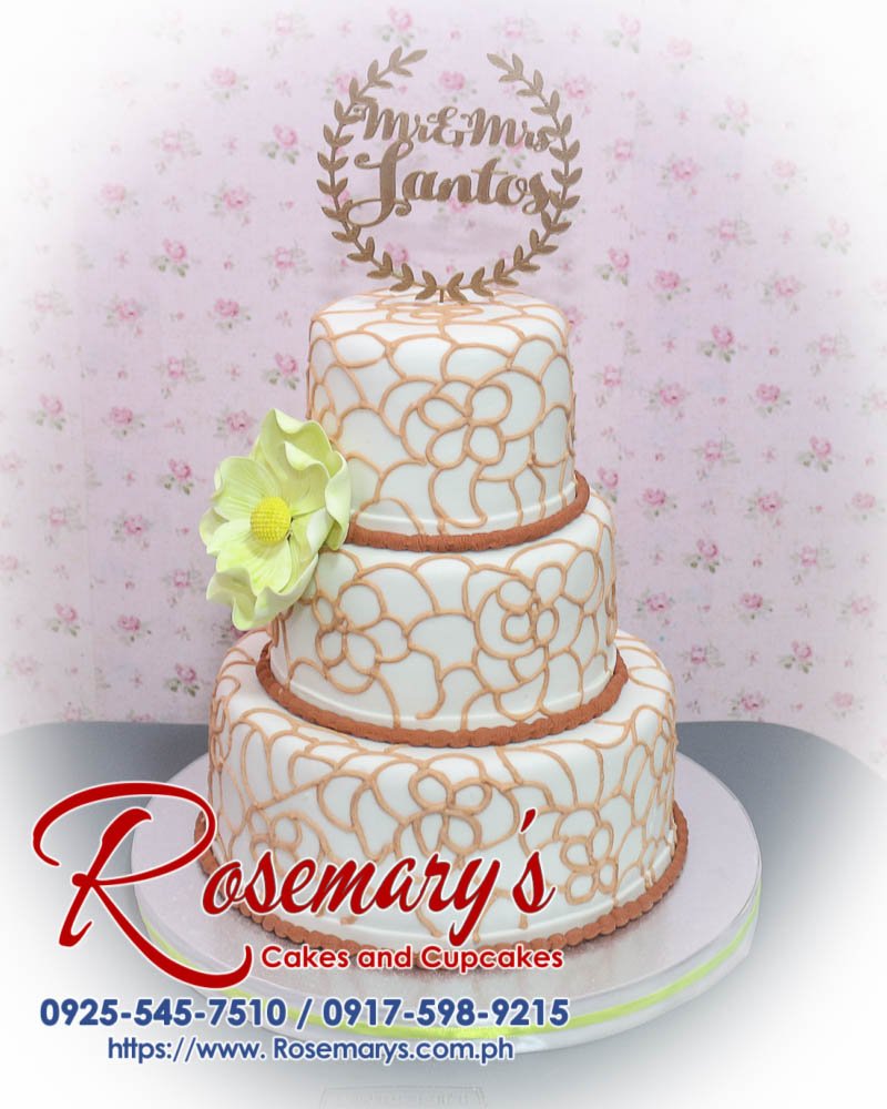 3 Layer Wedding Cake for Mr and Mrs Santos Elegant 3-layer wedding cake featuring a 3D printed topper, perfect for a themed celebration. Order from Rosemary's Cakes at 0917-598-9215.