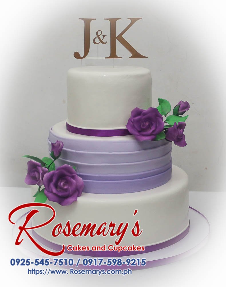 Elegant 3-tier wedding cake adorned with purple buttercream flowers and a custom 3D printed J&K topper. Rosemary's Cakes | 0925-545-7510