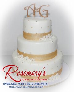 Delicious 3-tier white wedding cake with custom gold "A&G" 3D printed topper. Order your dream cake from Rosemary's Cakes: 0917-598-9215