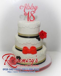 Delicious 3-layer red and white cake with intricate design. Perfect for birthdays or special occasions. Order yours from Rosemary's Cakes: 0925-545-7510